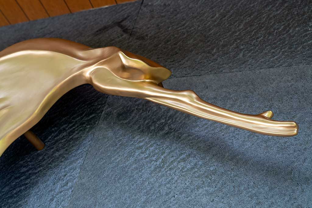 After — close-up of head and beak detail, gold finish