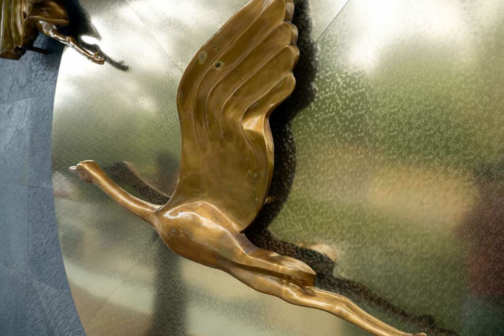 Before — overview of copper birds showing paint degradation and staining