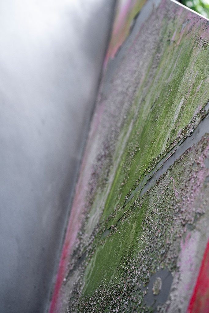 Before — overall view showing heavy paint loss across red face