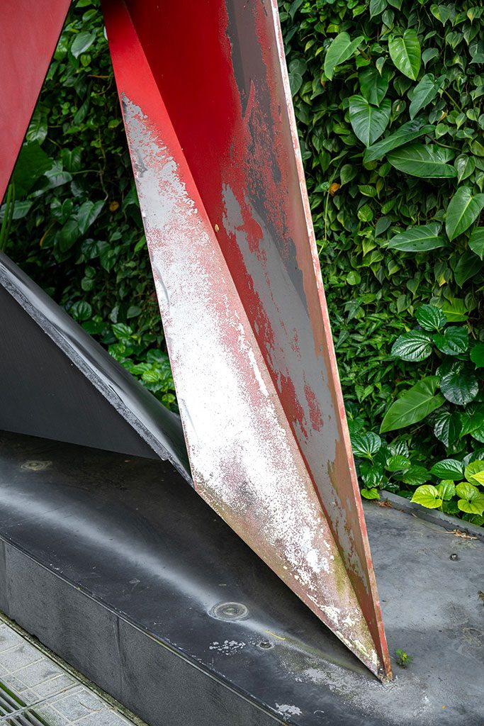 Before — detail of paint flaking and bare metal exposure