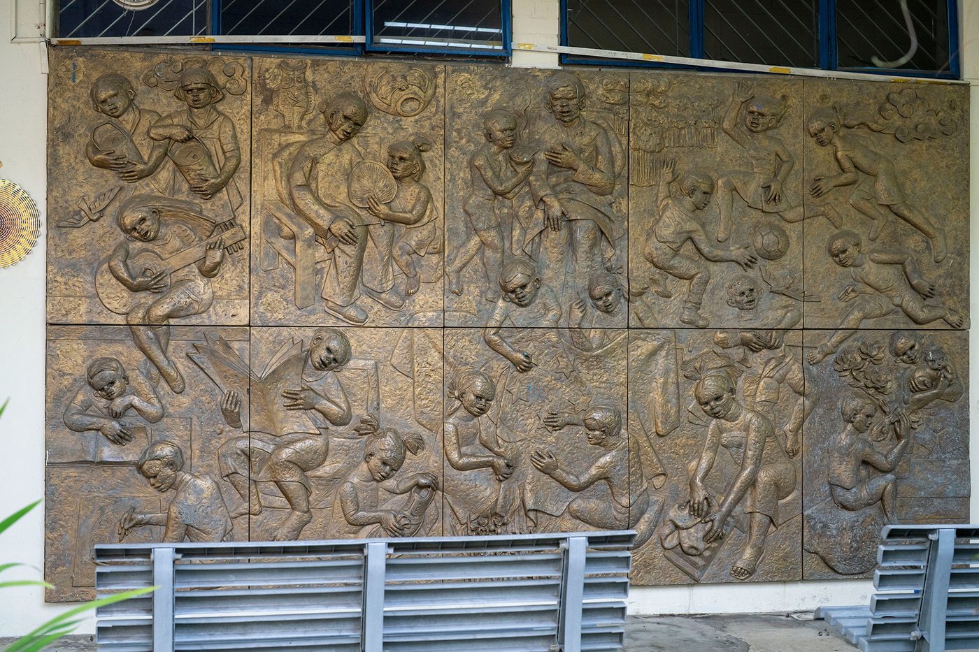 Before — wall relief at old campus, 40+ years of deterioration