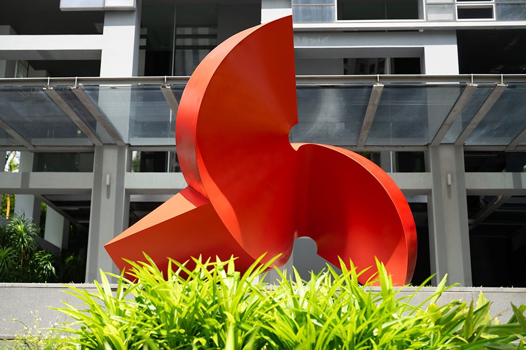 After restoration — close-up of restored red finish against building