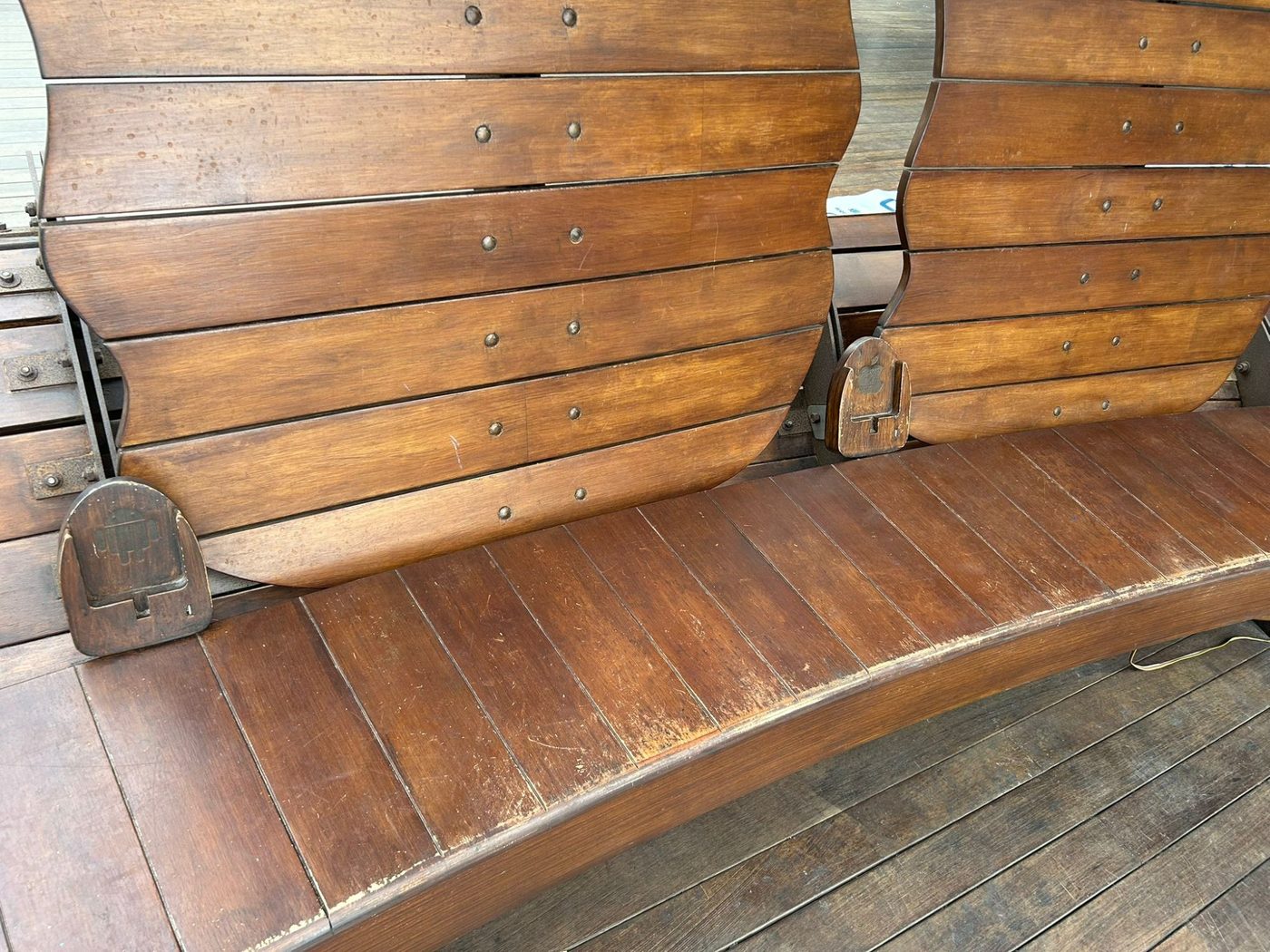 Before — faded, scratched timber seat surfaces
