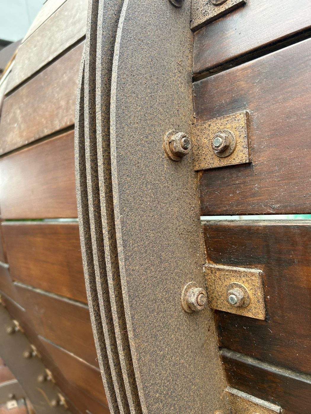 Before — close-up of heavily corroded metal frame